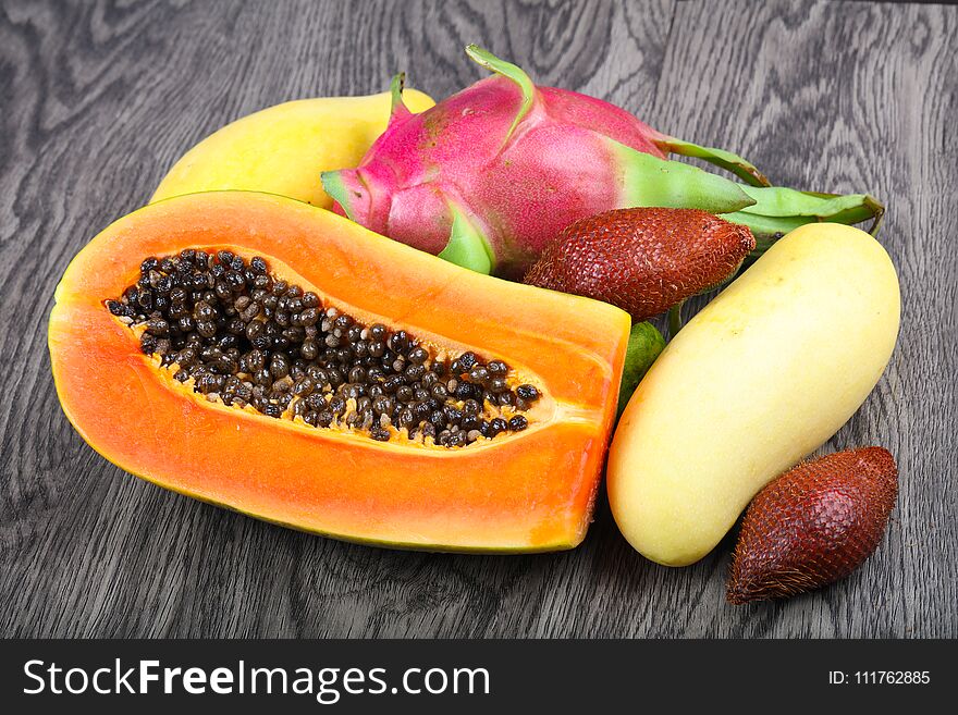 Tropical fruits - sala, papaya, mango and pitahaya
