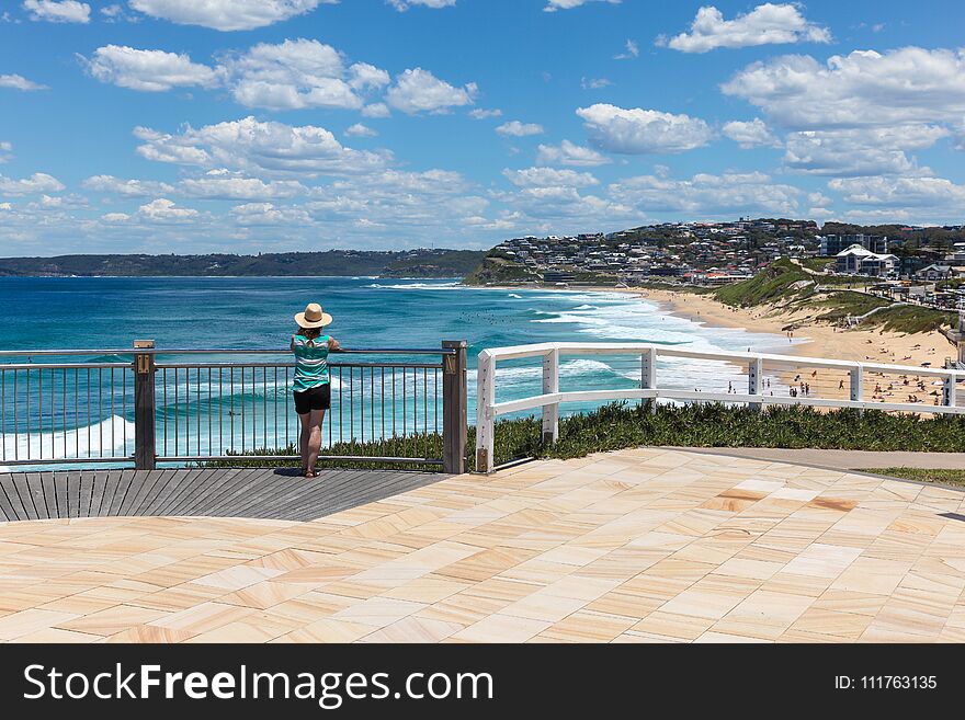 A woman enjoys the view of Bar beach - Merewether in Newcastle Australia. Bather`s way is a newly developed coast walk in Australia`s second oldest city a few hours drive north from Sydney. A woman enjoys the view of Bar beach - Merewether in Newcastle Australia. Bather`s way is a newly developed coast walk in Australia`s second oldest city a few hours drive north from Sydney.
