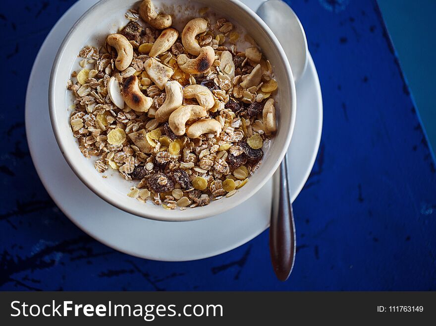 Muesli and nuts in yogurt in a plate