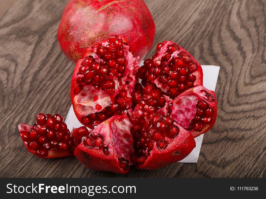 Fresh sweet ripe Pomegranate fruit on the wood background