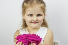 Portrait Of A Cute Girl With A Pink Rose Stock Photo