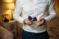 Close-up Businessman Groom Holding Bow-tie In His Hands. Concept Of Men Stylish Elegance Clothes Stock Image