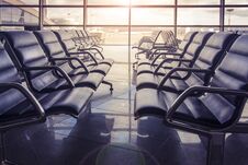 Seats In The Airport Waiting Room At Sunset. No One Is Sitting In The Airport. Royalty Free Stock Images