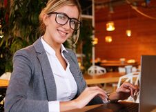 Business Wooman Using Laptop At Cafe. Young Beautiful Girl Sitti Stock Image Business Wooman Using Laptop At Cafe. Young Beautiful Girl Sitti Stock Image