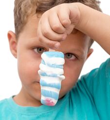 Boy Eating Ice Cream On A White Background Stock Images