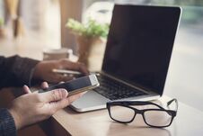 Businessman Using Laptop And Smart Phone Stock Images Businessman Using Laptop And Smart Phone Stock Images