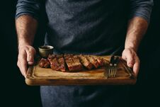 Man Holding Juicy Grilled Beef Steak Spices Cutting Board Stock Images