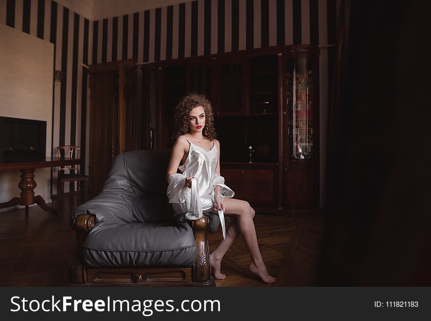 Young, Sexy, Positive Girl Sitting On The Couch