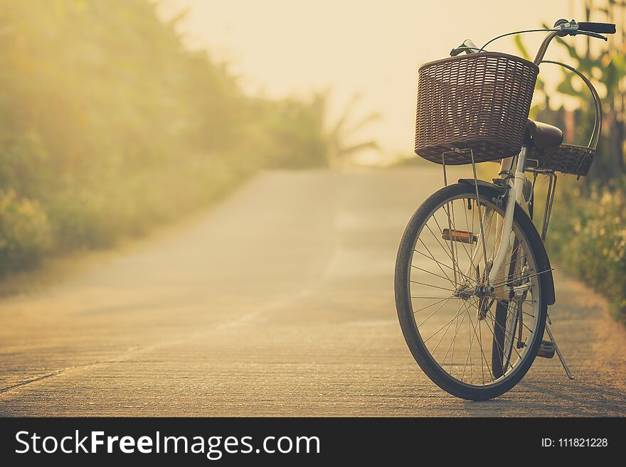 Bicycle on the side of the road way with mountains background. Copy space for text or article. Bicycle on the side of the road way with mountains background. Copy space for text or article.