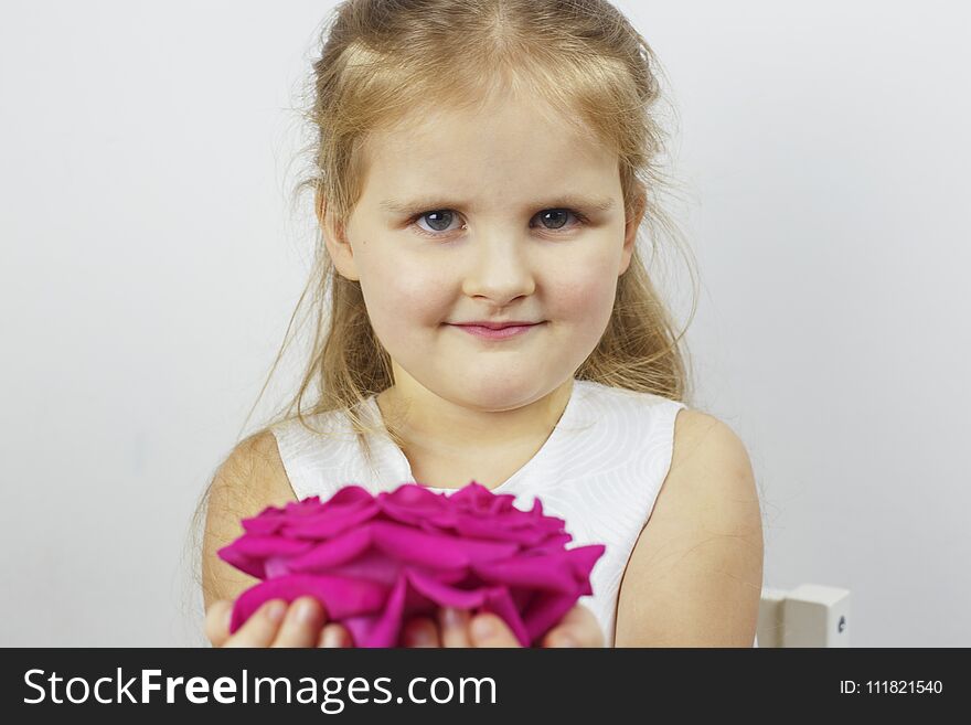 Portrait Of A Cute Girl With A Pink Rose