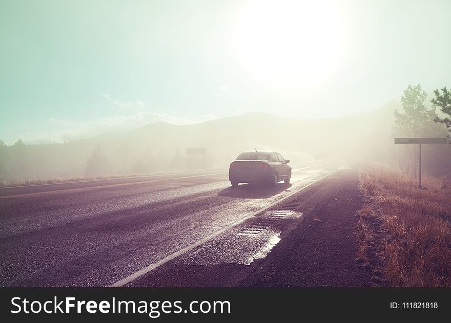 Misty road on rainy day