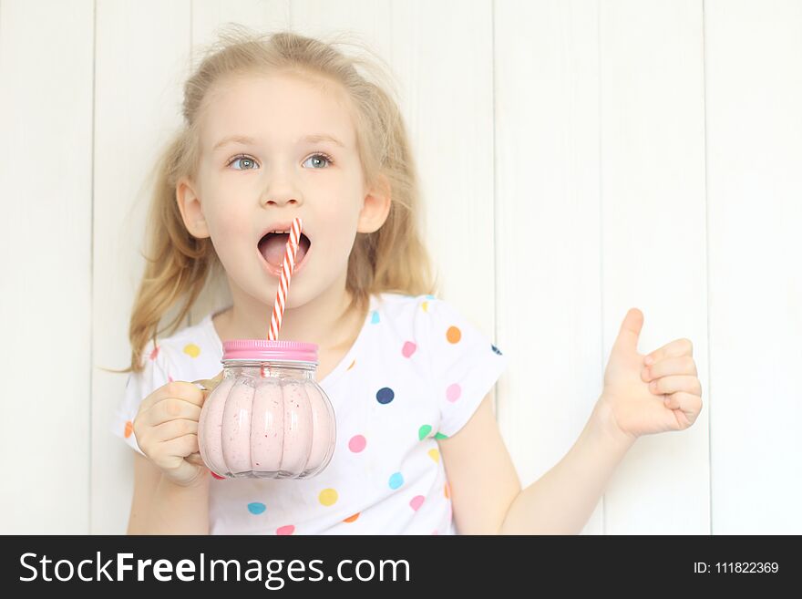 Beautiful girl drinking smoothie shake