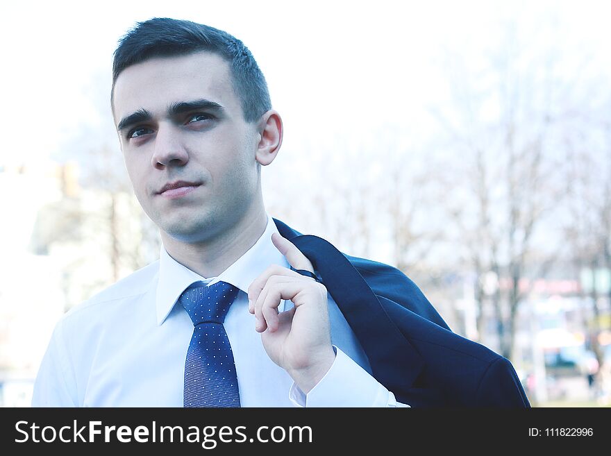 Close Up.young Businessman Standing In Modern City