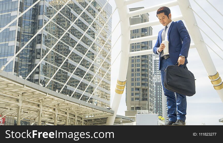 Business man stand with feeling confident and freedom at outdoor