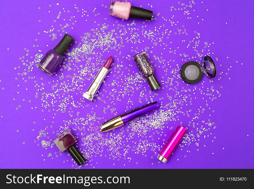Make up purple on an ultra purple background with sparkles. Flat