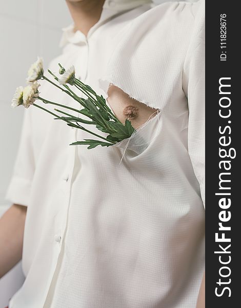 Man In White Button-up Shirt With White Flowers