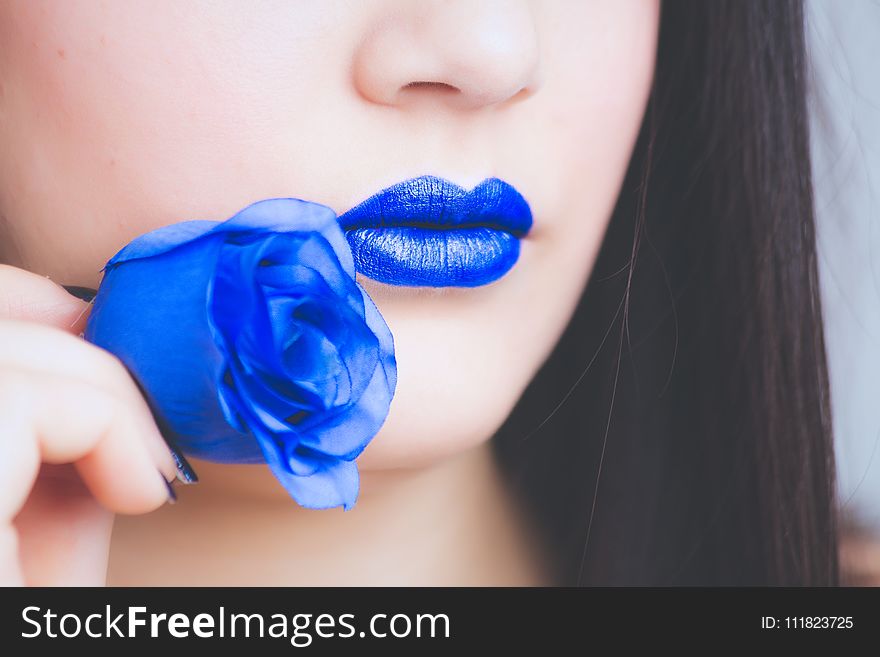 Woman In Blue Lipstick Holding Blue Rose Flower