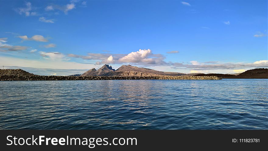 Landscape Photography of Mountain Near Body of Water