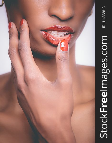 Woman With Red Lipstick and Red Manicure