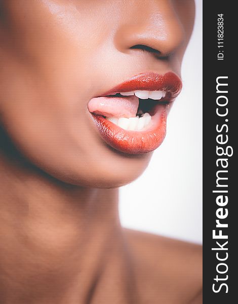 Selective Focus Photograph of Woman Sticking Her Tongue Out