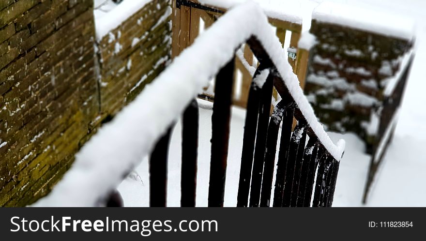 Shallow Focus of Black Stair Frames Covered in Snow