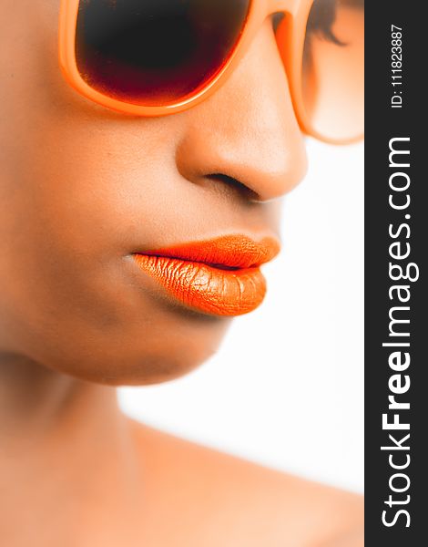Woman Wearing Orange-framed Sunglasses and Orange Lipstick
