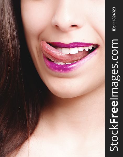 Woman Licking With Purple Lips