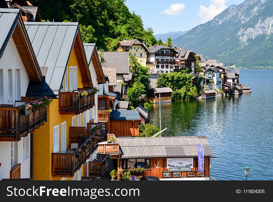 Photography of Houses Beside Body of Water