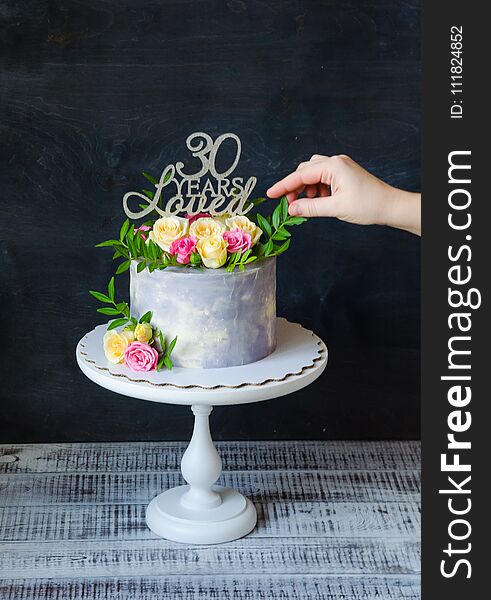 30th anniversary cake with roses on cake stand