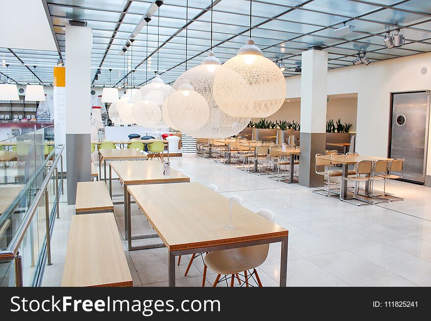 Interior of a light cafe in Europe. A modern cafe, restaurant or snack bar. Interior of the restaurant.