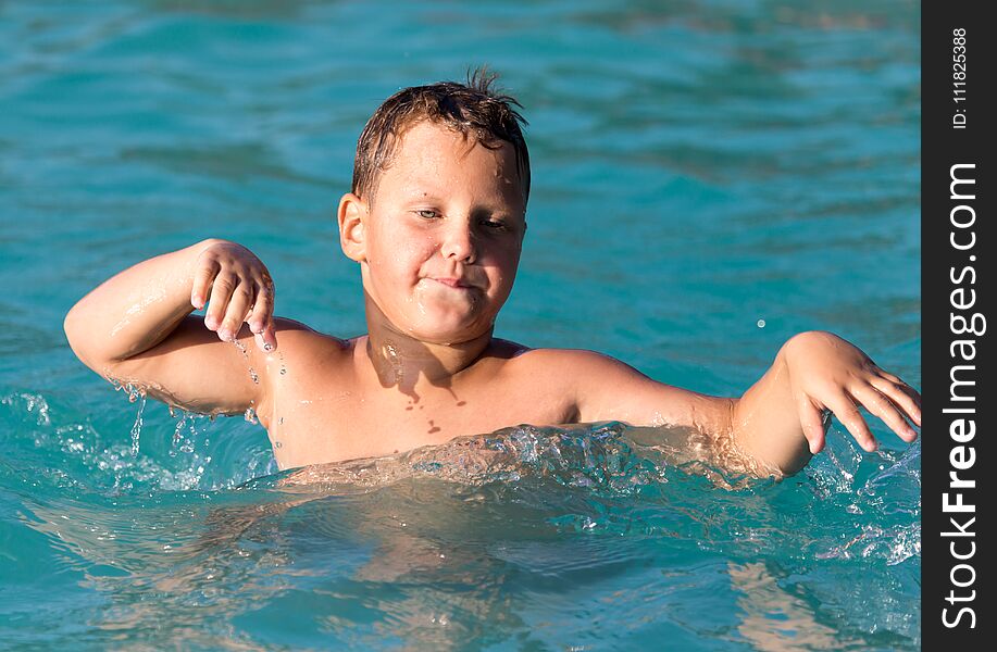 Boy swims in the water park
