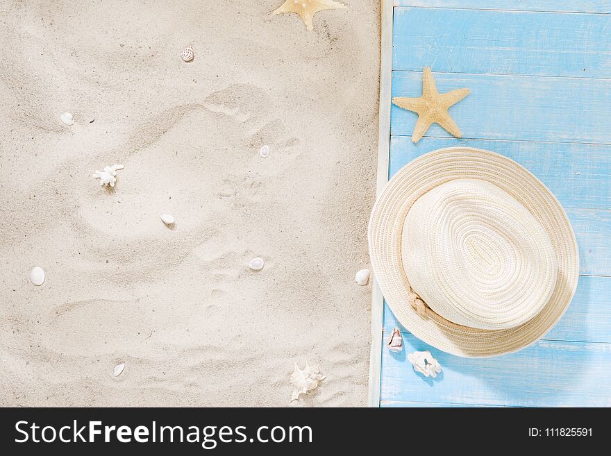 Top view straw hat with copy space. Traveler accessories on sand. Travel vacation concept. Summer background. Top view straw hat with copy space. Traveler accessories on sand. Travel vacation concept. Summer background