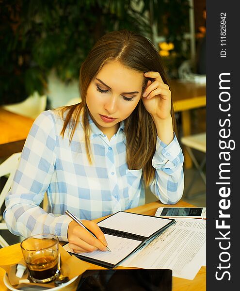 Lifestyle, business and people concept: business woman working planning concept in a cafe.