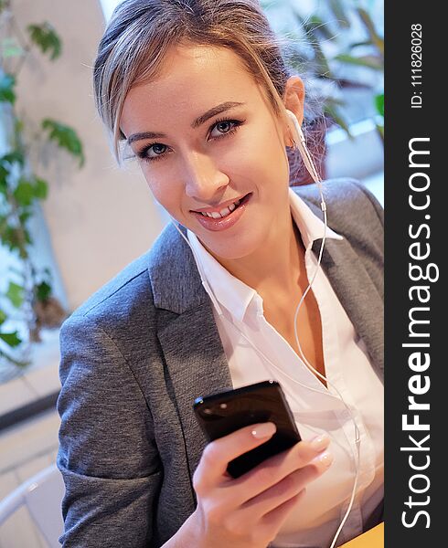 Business and people concept: Young Businesswoman with mobile phone