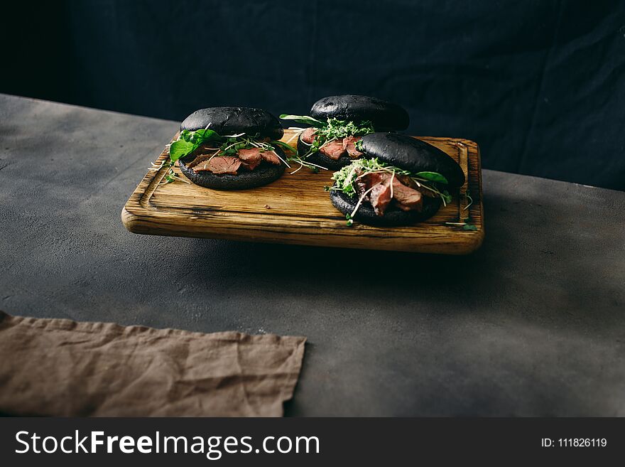 Set Black Burger Beef Medium Rare, Spinach, Green Sauce Microgreens