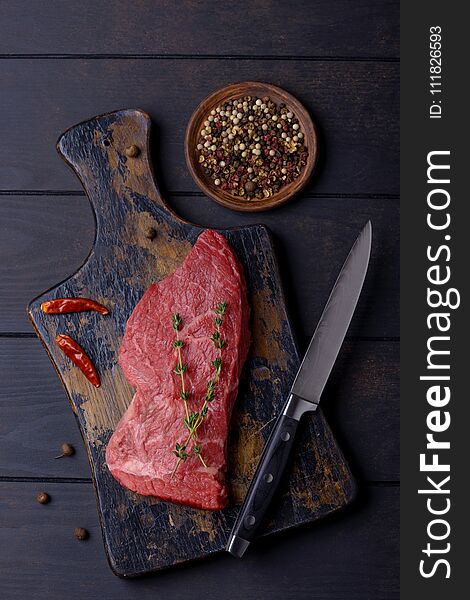 Beef steak and knife. Ingredients and spices for recipe