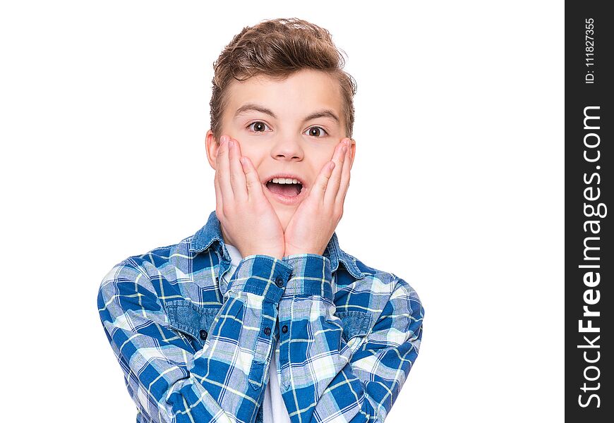 Emotional portrait of caucasian teen boy - surprised teenager looking at camera. Handsome child, isolated on white background. Emotional portrait of caucasian teen boy - surprised teenager looking at camera. Handsome child, isolated on white background.