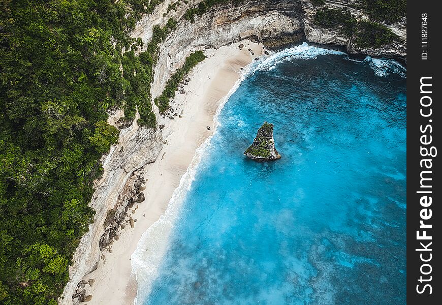 Amazing Beach With White Sand And Azure Sea Surrounded By Rocks,the View From The Top