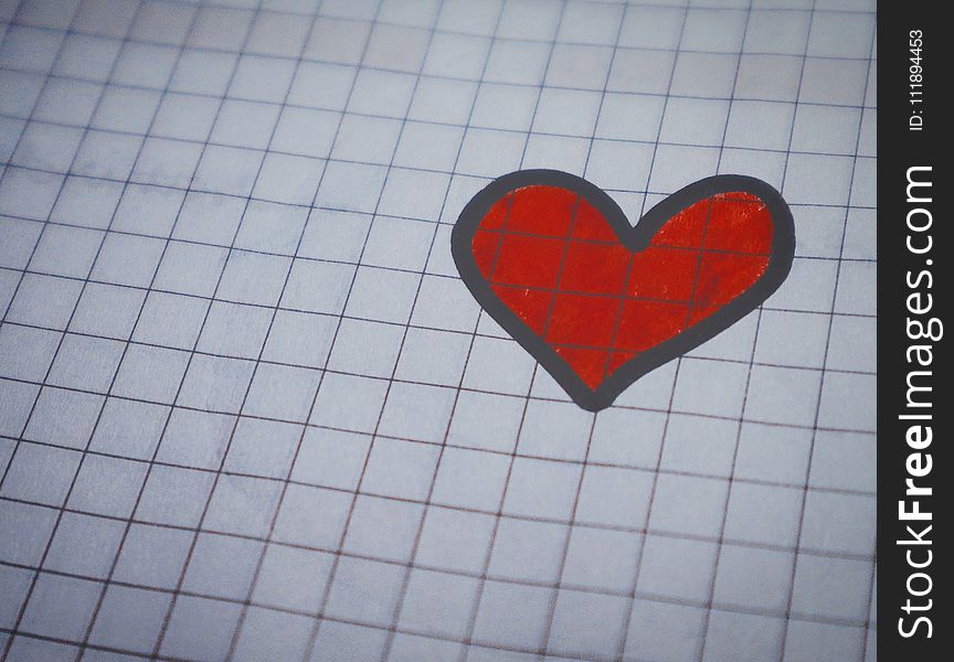 White Page of Graphing Paper With Red Heart Drawing