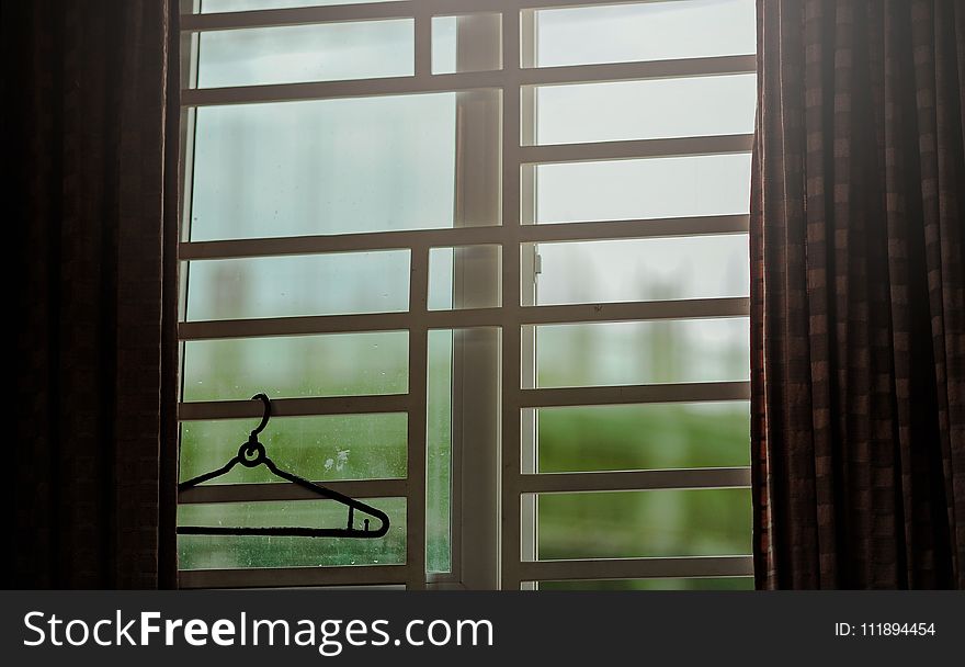 Black Clothes Hanger Hanged on Window