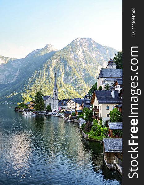 Houses Near the Bay and Mountain during Day