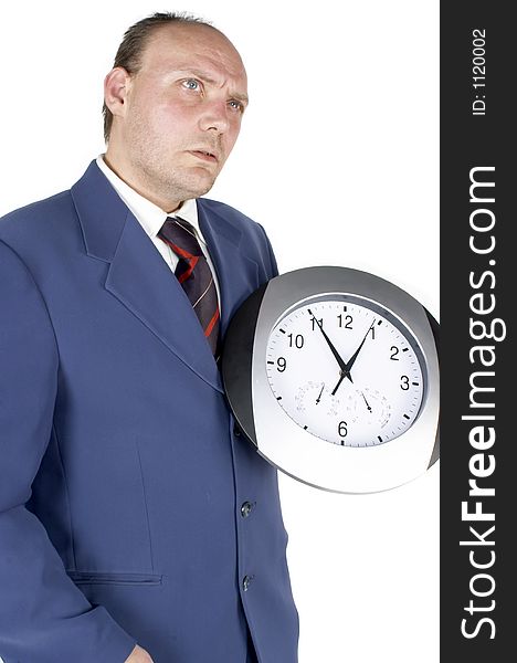 Businessman holding and looking at a clock. Businessman holding and looking at a clock