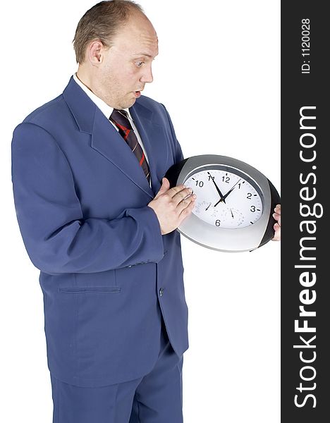 Businessman holding and looking at a clock. Businessman holding and looking at a clock