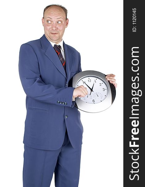 Businessman holding and looking at a clock. Businessman holding and looking at a clock