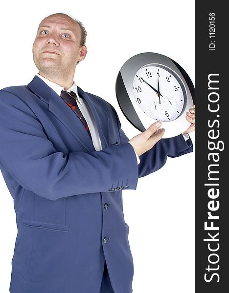 Businessman holding and looking at a clock. Businessman holding and looking at a clock