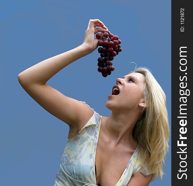 Girl eating Grapes