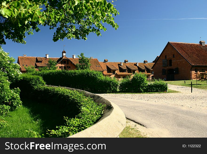 Road turning through a village in the countryside