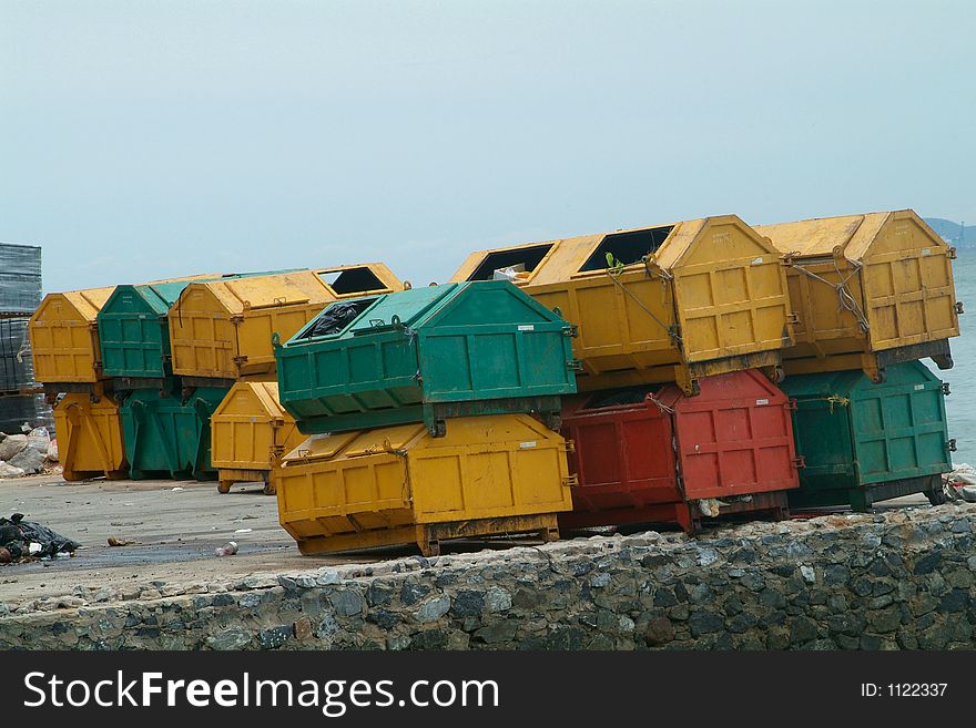 Yellow, green and red garbage containers