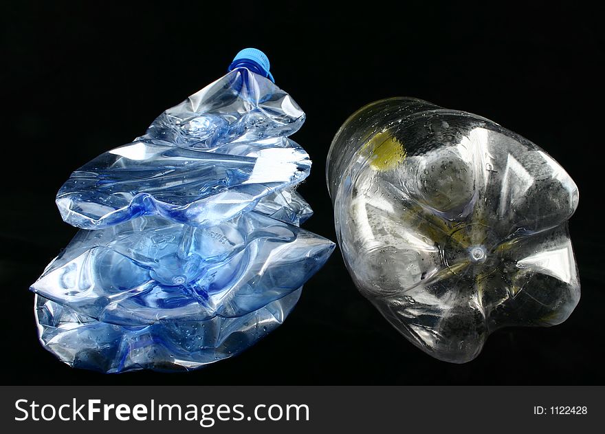 View of squeezed plastic bottles seen from the bottom. View of squeezed plastic bottles seen from the bottom