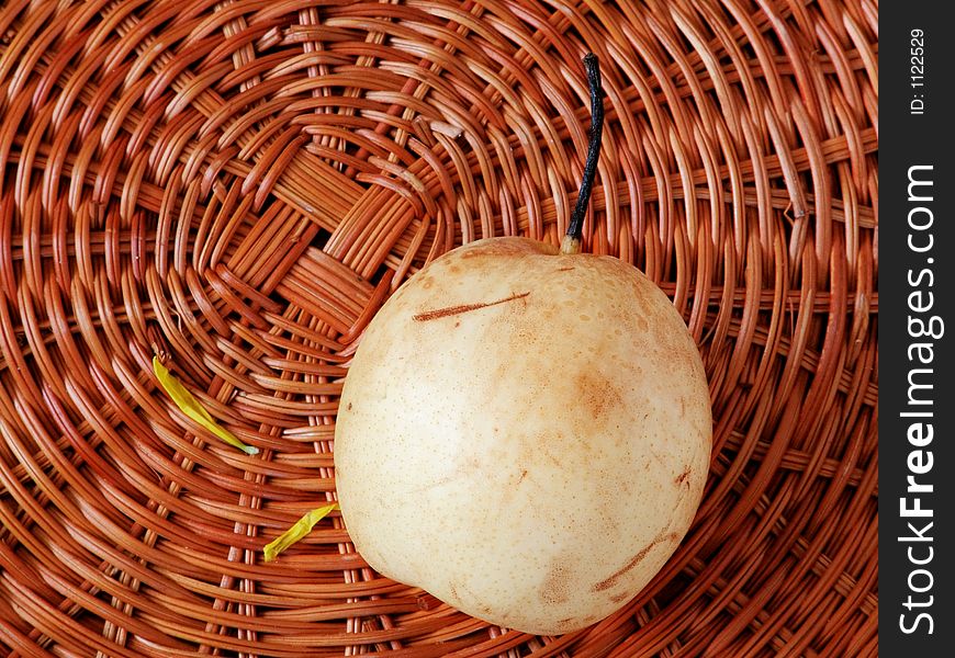 Fresh juicy pear in the basket